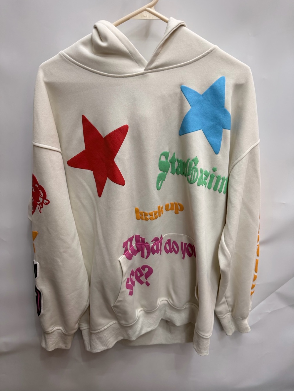 Cream Graphic Hoodie with Colorful Star Prints women’s size medium